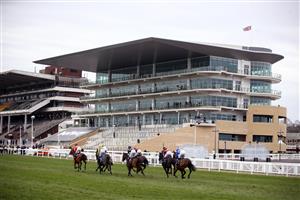 CHELTENHAM, ENGLAND - MARCH 17: The field pass an empty grand stand during the Ballymore Novices' Hurdle on day two of the Cheltenham Festival at Cheltenham Racecourse on March 17, 2021 in Cheltenham, England. Sporting venues around the UK remain under strict restrictions due to the Coronavirus Pandemic as Government social distancing laws prohibit spectators inside venues resulting in events being held behind closed doors. (Photo by Tim Goode - Pool/Getty Images)