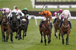 CHELTENHAM, ENGLAND - MARCH 17: Aidan Coleman riding Put The Kettle On (orange) clear the last to win The Betway Queen Mother Champion Chase at Cheltenham Racecourse on March 17, 2021 in Cheltenham, England. Sporting venues around the UK remain under strict restrictions due to the Coronavirus Pandemic as Government social distancing laws prohibit spectators inside venues resulting in events being held behind closed doors. (Photo by Alan Crowhurst/Getty Images)
