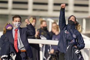 CHELTENHAM, ENGLAND - MARCH 17: Stable staff cheer the Denise Foster Tiger Roll to victory at Cheltenham Racecourse on March 17, 2021 in Cheltenham, England. Sporting venues around the UK remain under strict restrictions due to the Coronavirus Pandemic as Government social distancing laws prohibit spectators inside venues resulting in events being held behind closed doors. (Photo by Alan Crowhurst/Getty Images)