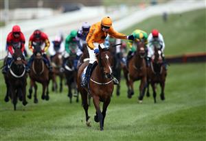 CHELTENHAM, ENGLAND - MARCH 17: Heaven Help Us ridden by Richard Condon celebrates after winning the Coral Cup Handicap Hurdle on day two of the Cheltenham Festival at Cheltenham Racecourse on March 17, 2021 in Cheltenham, England. Sporting venues around the UK remain under strict restrictions due to the Coronavirus Pandemic as Government social distancing laws prohibit spectators inside venues resulting in events being held behind closed doors. (Photo by Tim Goode - Pool/Getty Images)