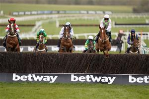CHELTENHAM, ENGLAND - MARCH 17: Paul Townend riding Monkfish (pink/green) on their way to winning The Brown Advisory Novices' Chase and is greeted by trainer Willie Mullins (R) at Cheltenham Racecourse on March 17, 2021 in Cheltenham, England. Sporting venues around the UK remain under strict restrictions due to the Coronavirus Pandemic as Government social distancing laws prohibit spectators inside venues resulting in events being held behind closed doors. (Photo by Alan Crowhurst/Getty Images)