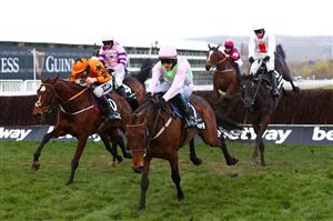 CHELTENHAM, ENGLAND - MARCH 17: Put The Kettle On ridden by Aidan Coleman (Orange and Black) and Chacun Pour Soi ridden by Paul Townend (Pink and Green) jump the last fence during the Betway Queen Mother Champion Chase (Grade 1) race on Day Two of the Cheltenham Festival 2021 at Cheltenham Racecourse on March 17, 2021 in Cheltenham, England. Sporting venues around the UK remain under strict restrictions due to the Coronavirus Pandemic as Government social distancing laws prohibit spectators inside venues resulting in events being held behind closed doors. (Photo by Michael Steele/Getty Images)