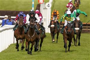 CHELTENHAM, ENGLAND - MARCH 18: Danny Mullins riding Flooring Porter (black/white) win The Paddy Power Stayers' Hurdle at Cheltenham Racecourse on March 18, 2021 in Cheltenham, England. Sporting venues around the UK remain under strict restrictions due to the Coronavirus Pandemic as Government social distancing laws prohibit spectators inside venues resulting in events being held behind closed doors. (Photo by Alan Crowhurst/Getty Images)