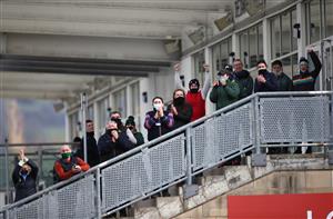 CHELTENHAM, ENGLAND - MARCH 18: Stable staff cheer on the winner of the Paddy Power Plate Handicap Chase, The Shunter ridden by Jordan Gainford during day three of the Cheltenham Festival at Cheltenham Racecourse on March 18, 2021 in Cheltenham, England. Sporting venues around the UK remain under strict restrictions due to the Coronavirus Pandemic as Government social distancing laws prohibit spectators inside venues resulting in events being held behind closed doors. (Photo by Tim Goode-Pool/Getty Images)