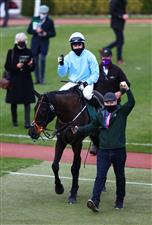 CHELTENHAM, ENGLAND - MARCH 18: Jordan Gainford celebrates as he is led into the winners enclosure after riding The Shunter to win the Paddy Power Plate Handicap Chase (Grade 3) during Day Three of the Cheltenham Festival 2021 at Cheltenham Racecourse on March 18, 2021 in Cheltenham, England. Sporting venues around the UK remain under strict restrictions due to the Coronavirus Pandemic as Government social distancing laws prohibit spectators inside venues resulting in events being held behind closed doors. (Photo by Michael Steele/Getty Images)