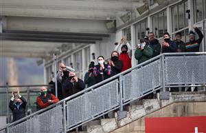 CHELTENHAM, ENGLAND - MARCH 18: Stable staff cheer on the winner of the Paddy Power Plate Handicap Chase, The Shunter ridden by Jordan Gainford during day three of the Cheltenham Festival at Cheltenham Racecourse on March 18, 2021 in Cheltenham, England. Sporting venues around the UK remain under strict restrictions due to the Coronavirus Pandemic as Government social distancing laws prohibit spectators inside venues resulting in events being held behind closed doors. (Photo by Tim Goode-Pool/Getty Images)