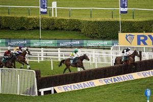 CHELTENHAM, ENGLAND - MARCH 18: Jack Kennedy riding Mount Ida (R) clear the last to win The Fulke Walwyn Kim Muir Challenge Cup Handicap Chase at Cheltenham Racecourse on March 18, 2021 in Cheltenham, England. Sporting venues around the UK remain under strict restrictions due to the Coronavirus Pandemic as Government social distancing laws prohibit spectators inside venues resulting in events being held behind closed doors. (Photo by Alan Crowhurst/Getty Images)