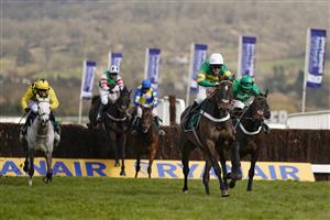 CHELTENHAM, ENGLAND - MARCH 18: Nico de Boinville riding Chantry House (white cap) clear the last to win The Marsh Novices' Chase at Cheltenham Racecourse on March 18, 2021 in Cheltenham, England. Sporting venues around the UK remain under strict restrictions due to the Coronavirus Pandemic as Government social distancing laws prohibit spectators inside venues resulting in events being held behind closed doors. (Photo by Alan Crowhurst/Getty Images)
