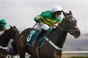 CHELTENHAM, ENGLAND - MARCH 18: Nico de Boinville riding Chantry House (white cap) clear the last to win The Marsh Novices' Chase at Cheltenham Racecourse on March 18, 2021 in Cheltenham, England. Sporting venues around the UK remain under strict restrictions due to the Coronavirus Pandemic as Government social distancing laws prohibit spectators inside venues resulting in events being held behind closed doors. (Photo by Alan Crowhurst/Getty Images)