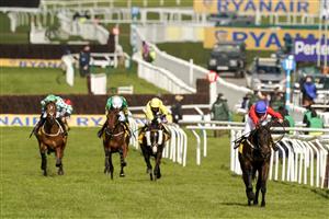 CHELTENHAM, ENGLAND - MARCH 18: Rachael Blackmore riding Allaho (red) clear the last to win The Ryanair Chase at Cheltenham Racecourse on March 18, 2021 in Cheltenham, England. Sporting venues around the UK remain under strict restrictions due to the Coronavirus Pandemic as Government social distancing laws prohibit spectators inside venues resulting in events being held behind closed doors. (Photo by Alan Crowhurst/Getty Images)