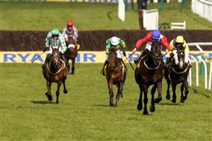 CHELTENHAM, ENGLAND - MARCH 18: Rachael Blackmore riding Allaho (red) clear the last to win The Ryanair Chase at Cheltenham Racecourse on March 18, 2021 in Cheltenham, England. Sporting venues around the UK remain under strict restrictions due to the Coronavirus Pandemic as Government social distancing laws prohibit spectators inside venues resulting in events being held behind closed doors. (Photo by Alan Crowhurst/Getty Images)