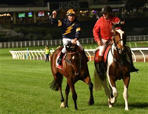 MELBOURNE, AUSTRALIA - MARCH 19: William Pike riding Masked Crusader after winning Race 7, the Keogh Homes William Reid Stakes, during Melbourne Racing at Moonee Valley Racecourse on March 19, 2021 in Melbourne, Australia. (Photo by Vince Caligiuri/Getty Images)