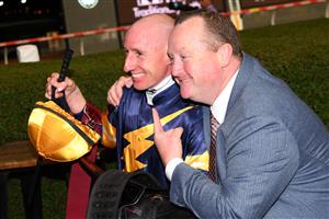 MELBOURNE, AUSTRALIA - MARCH 19: William Pike poses with trainer Wayne Hawkes after riding Masked Crusader to win Race 7, the Keogh Homes William Reid Stakes, during Melbourne Racing at Moonee Valley Racecourse on March 19, 2021 in Melbourne, Australia. (Photo by Vince Caligiuri/Getty Images)