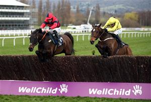 CHELTENHAM, ENGLAND - MARCH 19: Porlock Bay (left) ridden by Lorcan Williams on their way to winning the St. James's Place Festival Challenge Cup Open Hunters' Chase on day four of the Cheltenham Festival at Cheltenham Racecourse, on March 19, 2021 in Cheltenham, England. Sporting venues around the UK remain under strict restrictions due to the Coronavirus Pandemic as Government social distancing laws prohibit spectators inside venues resulting in events being held behind closed doors. (Photo by Tim Goode - Pool/Getty Images)