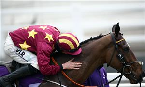 CHELTENHAM, ENGLAND - MARCH 19: Minella Indo ridden by Jack Kennedy celebrates after winning the WellChild Cheltenham Gold Cup Chase on day four of the Cheltenham Festival at Cheltenham Racecourse on March 19, 2021 in Cheltenham, England. Sporting venues around the UK remain under strict restrictions due to the Coronavirus Pandemic as Government social distancing laws prohibit spectators inside venues resulting in events being held behind closed doors. (Photo by Tim Goode - Pool/Getty Images)