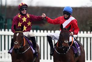 CHELTENHAM, ENGLAND - MARCH 19: Minella Indo ridden by Jack Kennedy (left) alongside Rachel Blackmore aboard A Plus Tard after winning the WellChild Cheltenham Gold Cup Chase on day four of the Cheltenham Festival at Cheltenham Racecourse on March 19, 2021 in Cheltenham, England. Sporting venues around the UK remain under strict restrictions due to the Coronavirus Pandemic as Government social distancing laws prohibit spectators inside venues resulting in events being held behind closed doors. (Photo by Tim Goode - Pool/Getty Images)