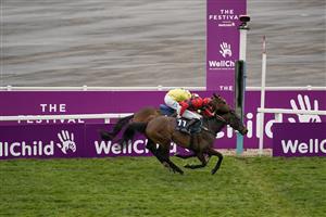 CHELTENHAM, ENGLAND - MARCH 19: Lorcan Williams riding Porlock Bay (red) clear the last to win The St. James's Place Festival Challenge Cup Open Hunters' Chase from Paul Townend and Billaway at Cheltenham Racecourse on March 19, 2021 in Cheltenham, England. Sporting venues around the UK remain under strict restrictions due to the Coronavirus Pandemic as Government social distancing laws prohibit spectators inside venues resulting in events being held behind closed doors. (Photo by Alan Crowhurst/Getty Images)