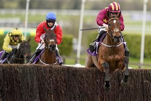CHELTENHAM, ENGLAND - MARCH 19: Jack Kennedy riding Minella Indo (R) clear the last to win The WellChild Cheltenham Gold Cup Chase from Rachael Blackmore and A Plus Tard (red) at Cheltenham Racecourse on March 19, 2021 in Cheltenham, England. Sporting venues around the UK remain under strict restrictions due to the Coronavirus Pandemic as Government social distancing laws prohibit spectators inside venues resulting in events being held behind closed doors. (Photo by Alan Crowhurst/Getty Images)