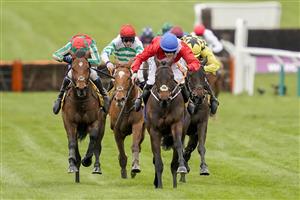 CHELTENHAM, ENGLAND - MARCH 19: Rachael Blackmore riding Quilixios (red) win The JCB Triumph Hurdle making it her sixth winner of the festival at Cheltenham Racecourse on March 19, 2021 in Cheltenham, England. Sporting venues around the UK remain under strict restrictions due to the Coronavirus Pandemic as Government social distancing laws prohibit spectators inside venues resulting in events being held behind closed doors. (Photo by Alan Crowhurst/Getty Images)