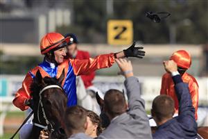 SYDNEY, AUSTRALIA - MARCH 27: Glen Boss on Think It Over (orange/blue) returns to scale after winning race 6 the Agency George Ryder Stakes during Golden Slipper Day at Rosehill Gardens on March 27, 2021 in Sydney, Australia. (Photo by Mark Evans/Getty Images)