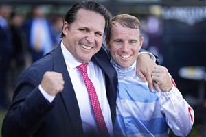 SYDNEY, AUSTRALIA - MARCH 27: Richard Freedman hugs Tommy Berry after his Golden Slipper win on Stay Inside during Golden Slipper Day at Rosehill Gardens on March 27, 2021 in Sydney, Australia. (Photo by Mark Evans/Getty Images)
