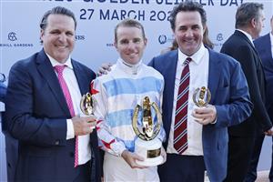 SYDNEY, AUSTRALIA - MARCH 27: Tommy Berry poses with trainers Richard and Michael Freedman after winning the Golden Slipper on Stay Inside during Golden Slipper Day at Rosehill Gardens on March 27, 2021 in Sydney, Australia. (Photo by Mark Evans/Getty Images)