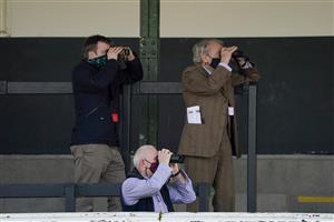 WARWICK, ENGLAND - MARCH 30: Owners watch the action from the orange zone at Warwick Racecourse on March 30, 2021 in Warwick, England. Sporting venues around the UK remain under restrictions due to the Coronavirus Pandemic. Only owners are allowed to attend the meeting but the public must wait until further restrictions are lifted. (Photo by Alan Crowhurst/Getty Images)