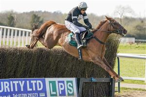 WARWICK, ENGLAND - MARCH 30: Harry Skelton riding King d'Argent clear the last to win The Bet At racingtv.com Handicap Chase at Warwick Racecourse on March 30, 2021 in Warwick, England. Sporting venues around the UK remain under restrictions due to the Coronavirus Pandemic. Only owners are allowed to attend the meeting but the public must wait until further restrictions are lifted. (Photo by Alan Crowhurst/Getty Images)