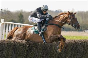 WARWICK, ENGLAND - MARCH 30: Harry Skelton riding King d'Argent clear the last to win The Bet At racingtv.com Handicap Chase at Warwick Racecourse on March 30, 2021 in Warwick, England. Sporting venues around the UK remain under restrictions due to the Coronavirus Pandemic. Only owners are allowed to attend the meeting but the public must wait until further restrictions are lifted. (Photo by Alan Crowhurst/Getty Images)