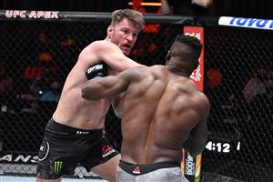 LAS VEGAS, NEVADA - MARCH 27: In this handout image provided by UFC, (L-R) Stipe Miocic punches Francis Ngannou of Cameroon in their UFC heavyweight championship fight during the UFC 260 event at UFC APEX on March 27, 2021 in Las Vegas, Nevada. (Photo by Jeff Bottari/Zuffa LLC via Getty Images)