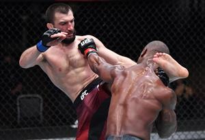 LAS VEGAS, NEVADA - MARCH 27: In this handout image provided by UFC, (L-R) Abubakar Nurmagomedov of Russia kicks Jared Gooden in their welterweight fight during the UFC 260 event at UFC APEX on March 27, 2021 in Las Vegas, Nevada. (Photo by Jeff Bottari/Zuffa LLC via Getty Images)
