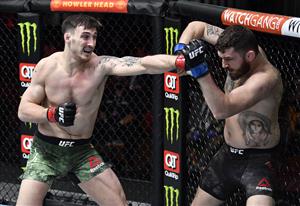 LAS VEGAS, NEVADA - MARCH 27: In this handout image provided by UFC, (L-R) Modestas Bukauskas of Lithuania punches Michal Oleksiejczuk of Poland in their light heavyweight fight during the UFC 260 event at UFC APEX on March 27, 2021 in Las Vegas, Nevada. (Photo by Jeff Bottari/Zuffa LLC via Getty Images)