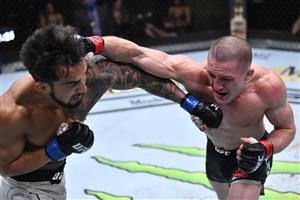 LAS VEGAS, NEVADA - MARCH 27: In this handout image provided by UFC, (R-L) Shane Young of New Zealand punches Omar Morales of Venezuela in their featherweight fight during the UFC 260 event at UFC APEX on March 27, 2021 in Las Vegas, Nevada. (Photo by Jeff Bottari/Zuffa LLC via Getty Images)
