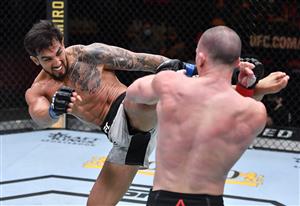 LAS VEGAS, NEVADA - MARCH 27: In this handout image provided by UFC, (L-R) Omar Morales of Venezuela kicks Shane Young of New Zealand in their featherweight fight during the UFC 260 event at UFC APEX on March 27, 2021 in Las Vegas, Nevada. (Photo by Jeff Bottari/Zuffa LLC via Getty Images)