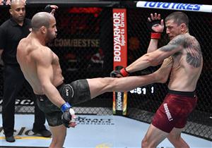 LAS VEGAS, NEVADA - MARCH 27: In this handout image provided by UFC, (L-R) Abu Azaitar of Morocco kicks Marc-Andre Barriault of Canada in their middleweight fight during the UFC 260 event at UFC APEX on March 27, 2021 in Las Vegas, Nevada. (Photo by Jeff Bottari/Zuffa LLC via Getty Images)