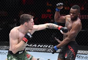 LAS VEGAS, NEVADA - MARCH 27: In this handout image provided by UFC, (L-R) Jamie Mullarkey of Australia punches Khama Worthy in their lightweight fight during the UFC 260 event at UFC APEX on March 27, 2021 in Las Vegas, Nevada. (Photo by Jeff Bottari/Zuffa LLC via Getty Images)