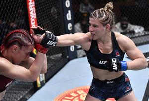 LAS VEGAS, NEVADA - MARCH 27: In this handout image provided by UFC, (R-L) Miranda Maverick punches Gillian Robertson of Canada in their lightweight fight during the UFC 260 event at UFC APEX on March 27, 2021 in Las Vegas, Nevada. (Photo by Jeff Bottari/Zuffa LLC via Getty Images)