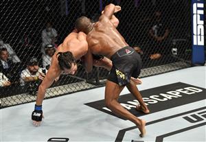 ABU DHABI, UNITED ARAB EMIRATES - JULY 12: In this handout image provided by UFC, (R-L) Kamaru Usman of Nigeria takes down Jorge Masvidal in their UFC welterweight championship fight during the UFC 251 event at Flash Forum on UFC Fight Island on July 12, 2020 on Yas Island, Abu Dhabi, United Arab Emirates. (Photo by Jeff Bottari/Zuffa LLC via Getty Images)