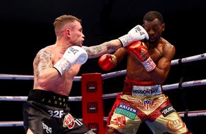 DUBAI, UNITED ARAB EMIRATES - APRIL 03: Carl Frampton(L) of Northern Ireland punches Jamel Herring (R) of the USA during the WBO World Super Featherweight Title Fight between Jamel Herring and Carl Frampton at The Rotunda at Caesars Palace on April 03, 2021 in Dubai, United Arab Emirates. (Photo by Francois Nel/Getty Images)