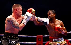 DUBAI, UNITED ARAB EMIRATES - APRIL 03: Jamel Herring (R) of the USA punches Carl Frampton of Northern Ireland during the WBO World Super Featherweight Title Fight between Jamel Herring and Carl Frampton at The Rotunda at Caesars Palace on April 03, 2021 in Dubai, United Arab Emirates. (Photo by Francois Nel/Getty Images)