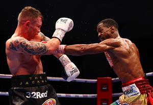 DUBAI, UNITED ARAB EMIRATES - APRIL 03: Jamel Herring (L) of the USA and Carl Frampton of Northern Ireland exchange punches during the WBO World Super Featherweight Title Fight between Jamel Herring and Carl Frampton at The Rotunda at Caesars Palace on April 03, 2021 in Dubai, United Arab Emirates. (Photo by Francois Nel/Getty Images)