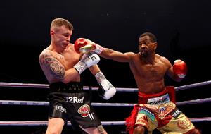 DUBAI, UNITED ARAB EMIRATES - APRIL 03: Jamel Herring (R) of the USA punches Carl Frampton of Northern Ireland during the WBO World Super Featherweight Title Fight between Jamel Herring and Carl Frampton at The Rotunda at Caesars Palace on April 03, 2021 in Dubai, United Arab Emirates. (Photo by Francois Nel/Getty Images)