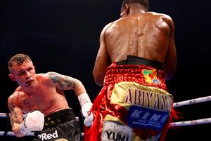 DUBAI, UNITED ARAB EMIRATES - APRIL 03: Jamel Herring (R) of the USA punches Carl Frampton of Northern Ireland during the WBO World Super Featherweight Title Fight between Jamel Herring and Carl Frampton at The Rotunda at Caesars Palace on April 03, 2021 in Dubai, United Arab Emirates. (Photo by Francois Nel/Getty Images)
