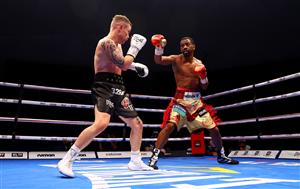 DUBAI, UNITED ARAB EMIRATES - APRIL 03: Jamel Herring (R) of the USA punches Carl Frampton of Northern Ireland during the WBO World Super Featherweight Title Fight between Jamel Herring and Carl Frampton at The Rotunda at Caesars Palace on April 03, 2021 in Dubai, United Arab Emirates. (Photo by Francois Nel/Getty Images)