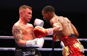 DUBAI, UNITED ARAB EMIRATES - APRIL 03: Jamel Herring (R) of the USA punches Carl Frampton of Northern Ireland during the WBO World Super Featherweight Title Fight between Jamel Herring and Carl Frampton at The Rotunda at Caesars Palace on April 03, 2021 in Dubai, United Arab Emirates. (Photo by Francois Nel/Getty Images)