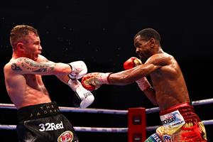 DUBAI, UNITED ARAB EMIRATES - APRIL 03: Jamel Herring (L) of the USA and Carl Frampton of Northern Ireland exchange punches during the WBO World Super Featherweight Title Fight between Jamel Herring and Carl Frampton at The Rotunda at Caesars Palace on April 03, 2021 in Dubai, United Arab Emirates. (Photo by Francois Nel/Getty Images)