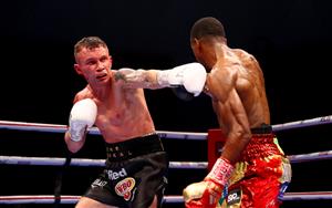 DUBAI, UNITED ARAB EMIRATES - APRIL 03: Carl Frampton (L) of Northern Ireland exchanges punches with Jamel Herring of the USA during the WBO World Super Featherweight Title Fight between Jamel Herring and Carl Frampton at The Rotunda at Caesars Palace on April 03, 2021 in Dubai, United Arab Emirates. (Photo by Francois Nel/Getty Images)