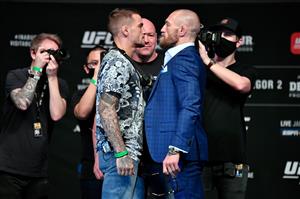 ABU DHABI, UNITED ARAB EMIRATES - JANUARY 21: In this handout image provided by the UFC, (L-R) Opponents Dustin Poirier and Conor McGregor pose face off for media during the UFC 257 press conference event inside Etihad Arena on UFC Fight Island on January 21, 2021 in Yas Island, Abu Dhabi, United Arab Emirates. (Photo by Jeff Bottari/Zuffa LLC via Getty Images)