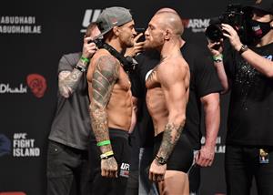 ABU DHABI, UNITED ARAB EMIRATES - JANUARY 22: In this handout image provided by the UFC, (L-R) Opponents Dustin Poirier and Conor McGregor of Ireland face off during the UFC 257 weigh-in at Etihad Arena on UFC Fight Island on January 22, 2021 in Abu Dhabi, United Arab Emirates. (Photo by Jeff Bottari/Zuffa LLC via Getty Images)
