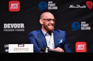 ABU DHABI, UNITED ARAB EMIRATES - JANUARY 21: In this handout image provided by the UFC, Conor McGregor of Ireland interacts with media during the UFC 257 press conference event inside Etihad Arena on UFC Fight Island on January 21, 2021 in Yas Island, Abu Dhabi, United Arab Emirates. (Photo by Jeff Bottari/Zuffa LLC via Getty Images)